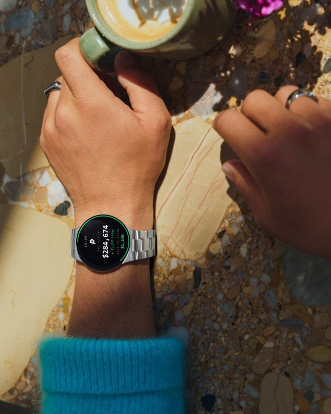 The Persistence widget on a Google Pixel Watch showing net worth and safe-to-spend